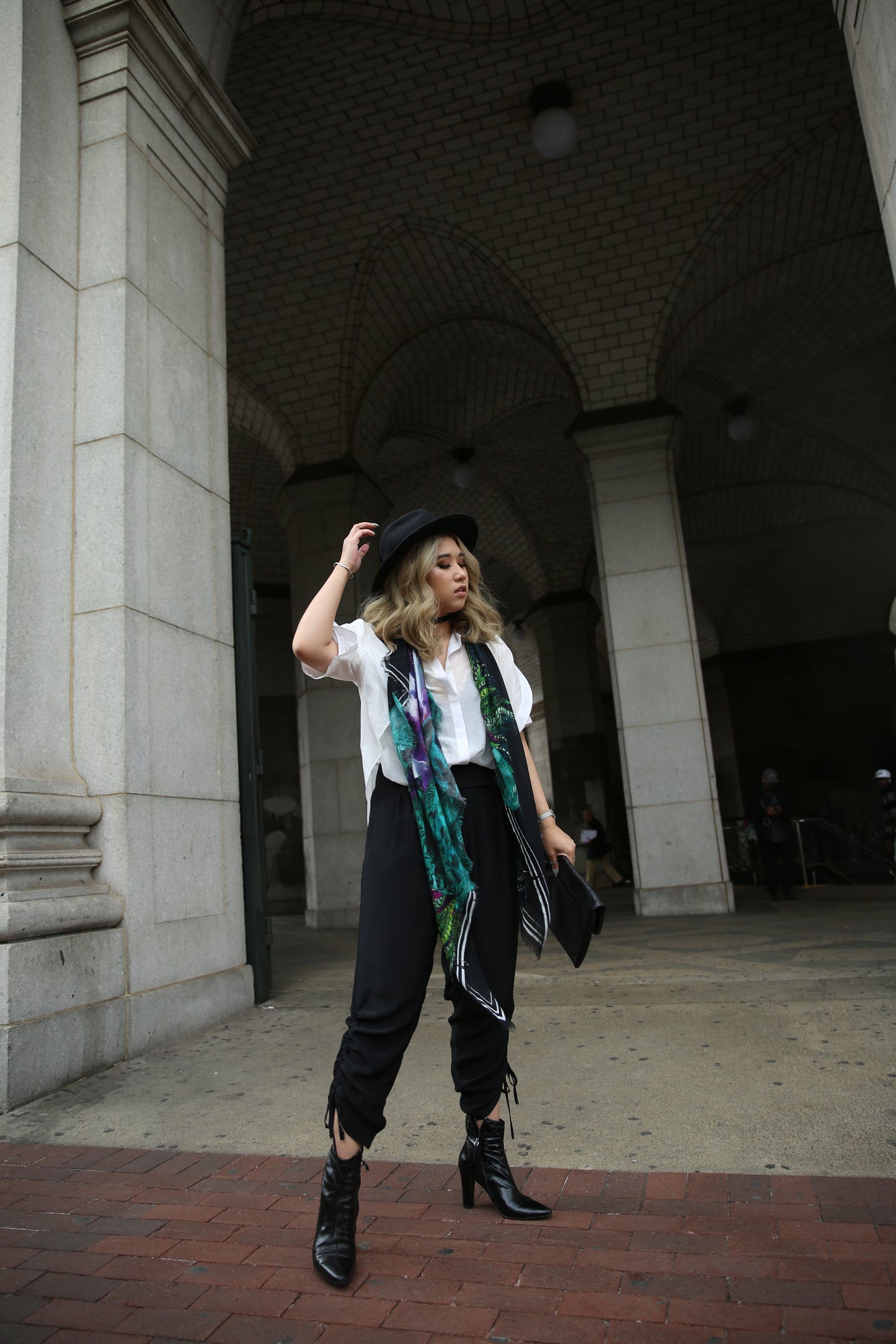 A model wearing Pants with contoured waist band and side drawstring detail in Black