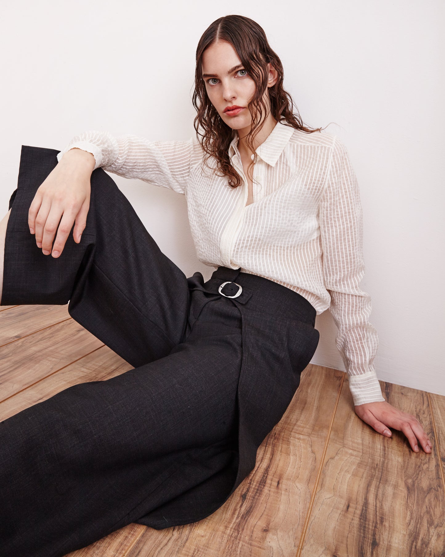 model wearing The Sheer Striped Volume-Sleeve V-Neck Blouse