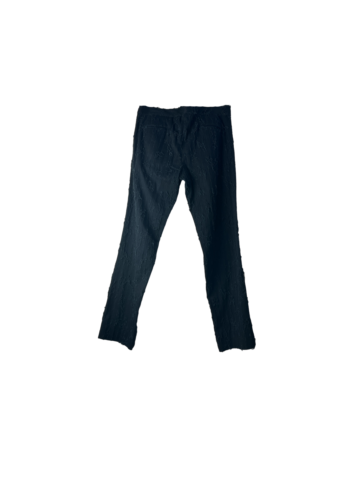 Back of black shredded cotton pants with side buckle belt detail
