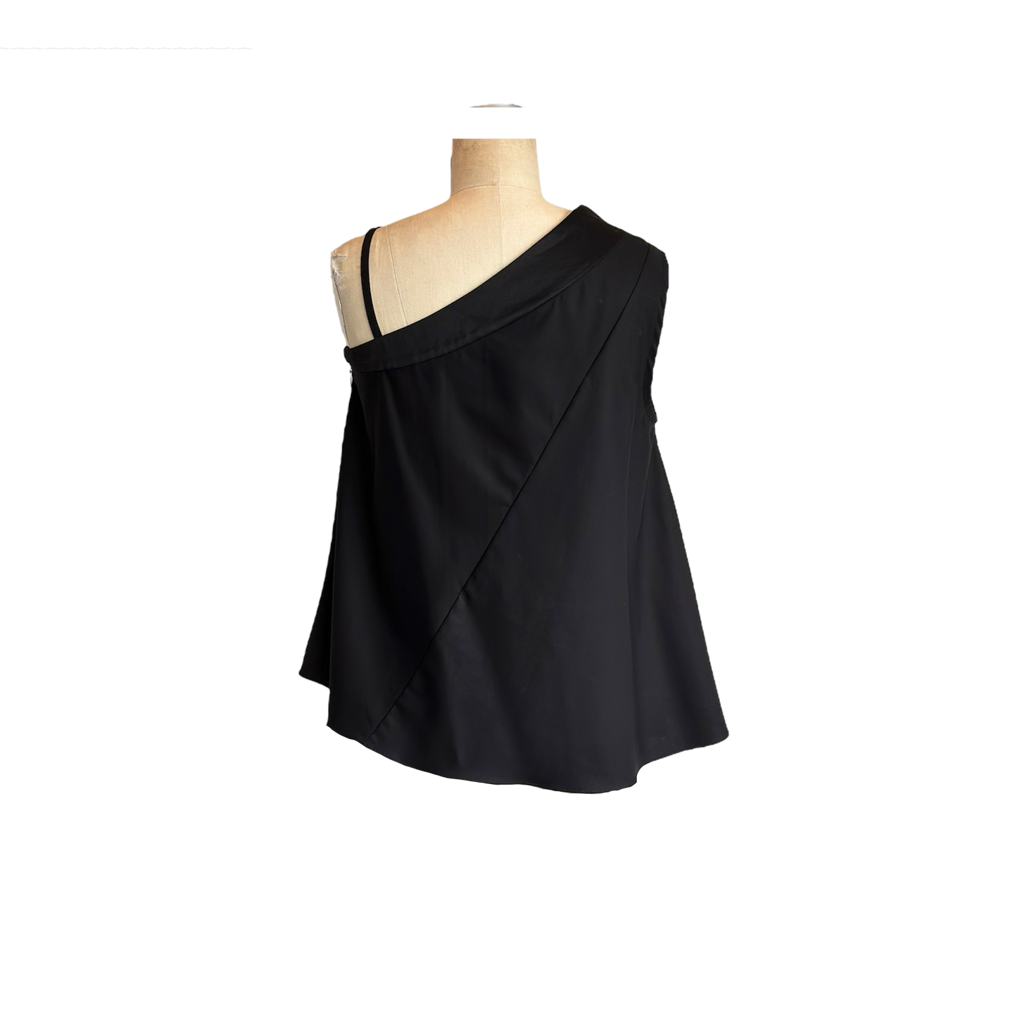 Back of solid black one shoulder top with asymmetric shoulder strap