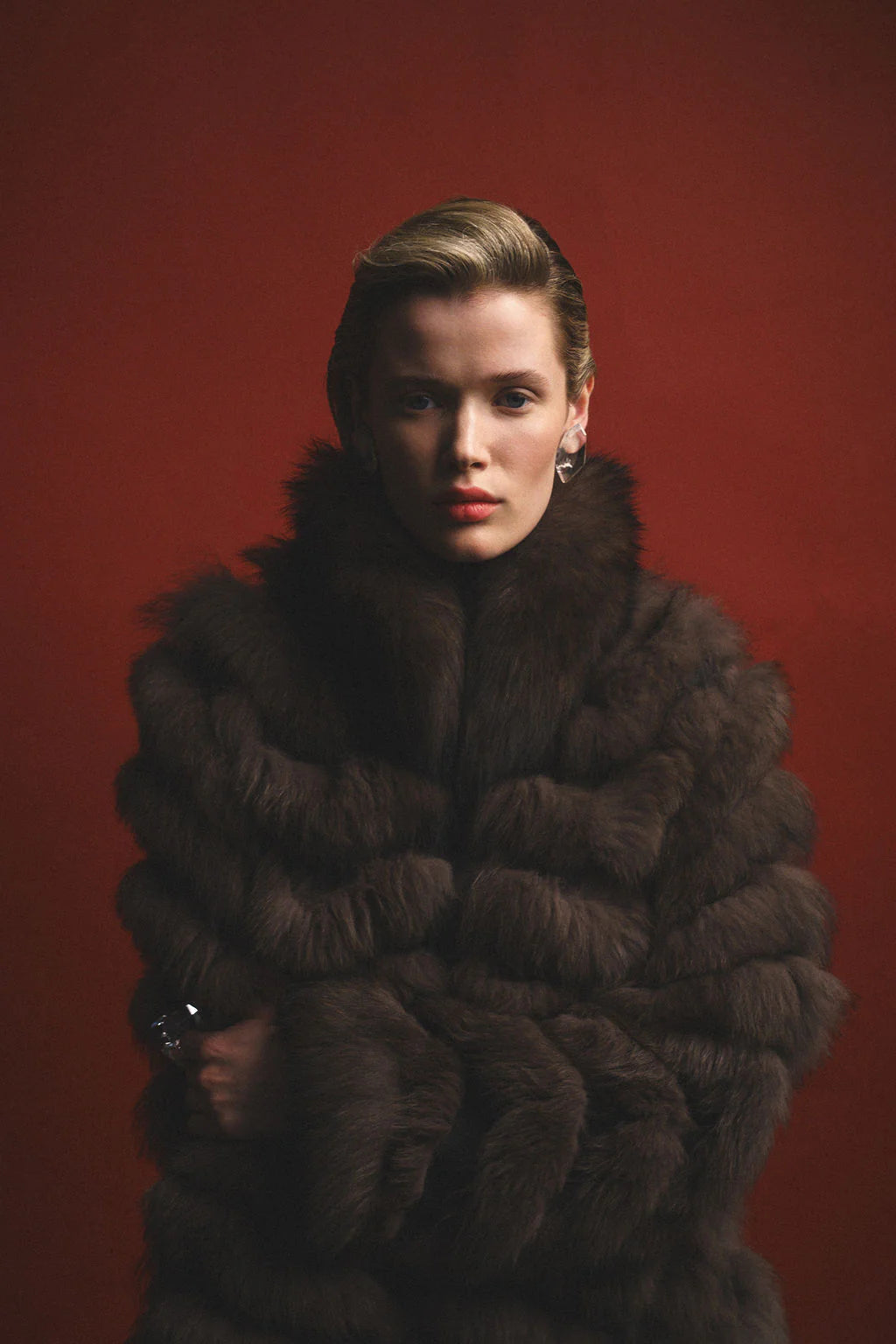 Woman wearing a fox fur coat with crossed arms.
Credits: Designer: @heike_ny
Wardrobe Stylist: @styledbynikolett Photographer: @shamayim Production Assistant: @monicaemcghee Accessories: @shopmeyvn Model: @veronicasandae Model: @fernandovaldez__ Makeup and Hair: @alexandraosipovamakeup Black Sheer top: @shacaro.official