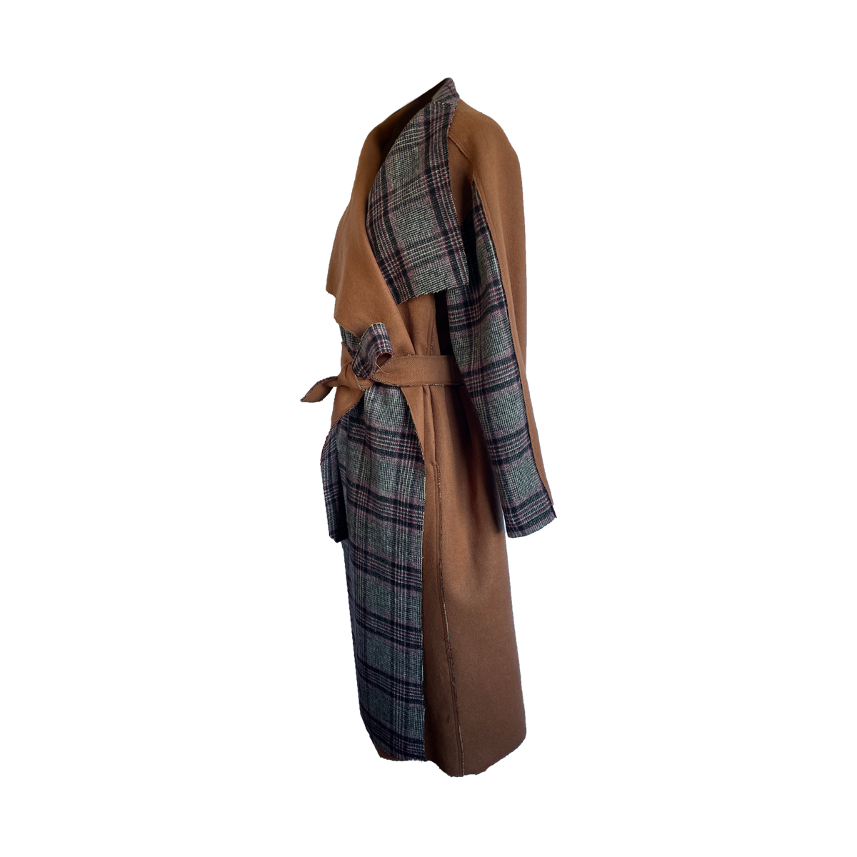 Side of double faced plaid wool coat with a wide lapel and accented sleeves.