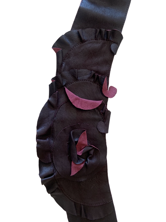 Patent black leather and rosette sculptural adjustable belt