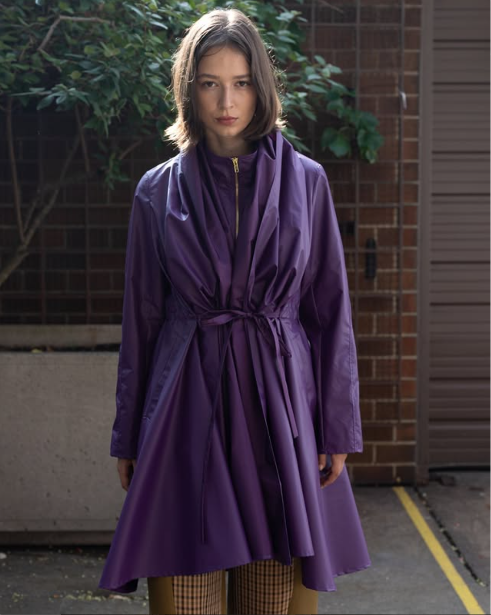 Woman wearing long purple coat featuring wrinkle fabric combined with a tie-belt. Standing straight in an outdoor environment with greenery in the background.

Stylist: @oxandsnake
Model : @wrocenska
Photographer: @straightupvision
Assistants: @liu_josxph & @peiyingr
Available at www.heike-ny.com and for press pulls @theconfessionalshowroomnyc