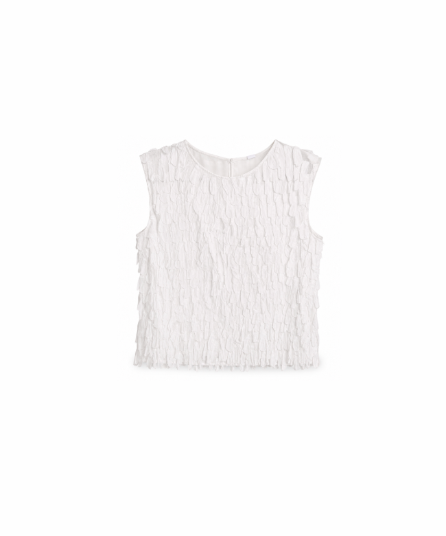 White cotton top with a scalloped texture