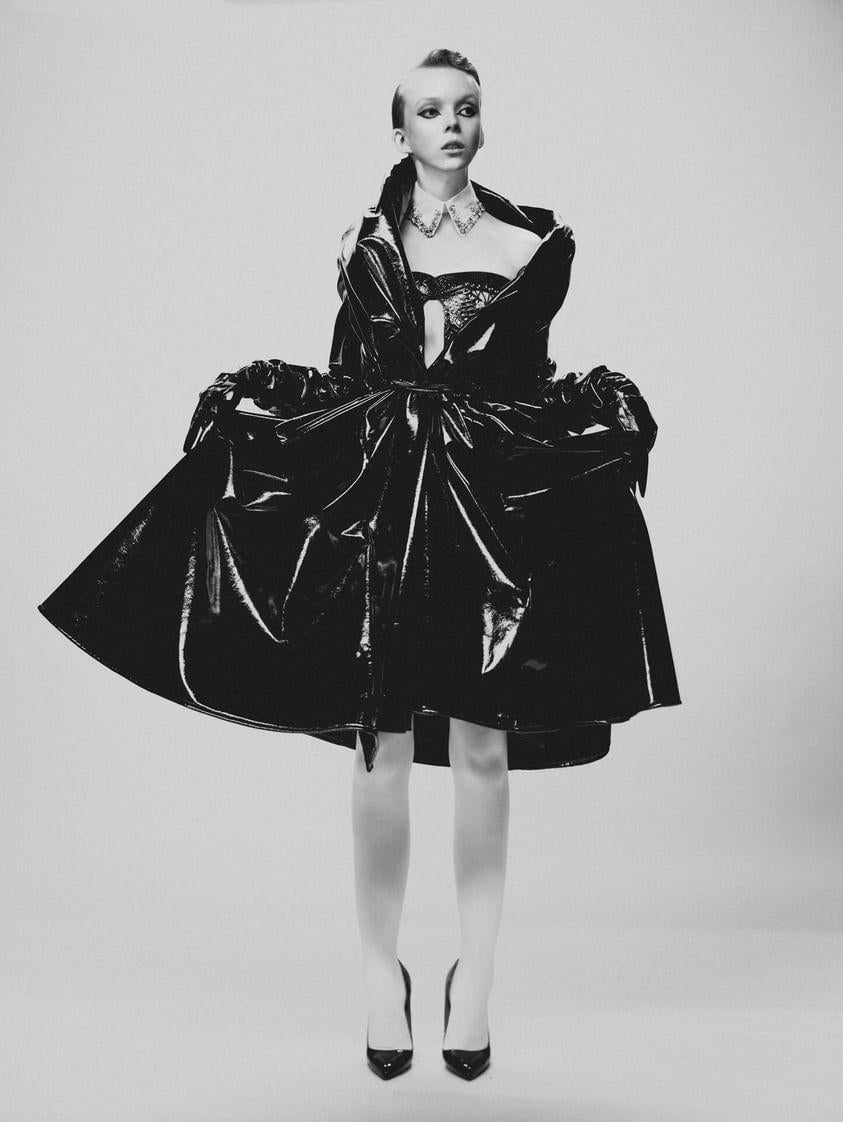 A black and white fashion portrait of a woman wearing a vegan leather patent martine coat and showing off the volume and flowyness by slightly lifing it up.

Model @_lilynova_ in our Martine patent coat Styled by @iamyoko.j Photographed by @tommychungphotography Mua @virginialefeiy Hair @fady_mlk Courtesy of @theconfessionalshowroomnyc