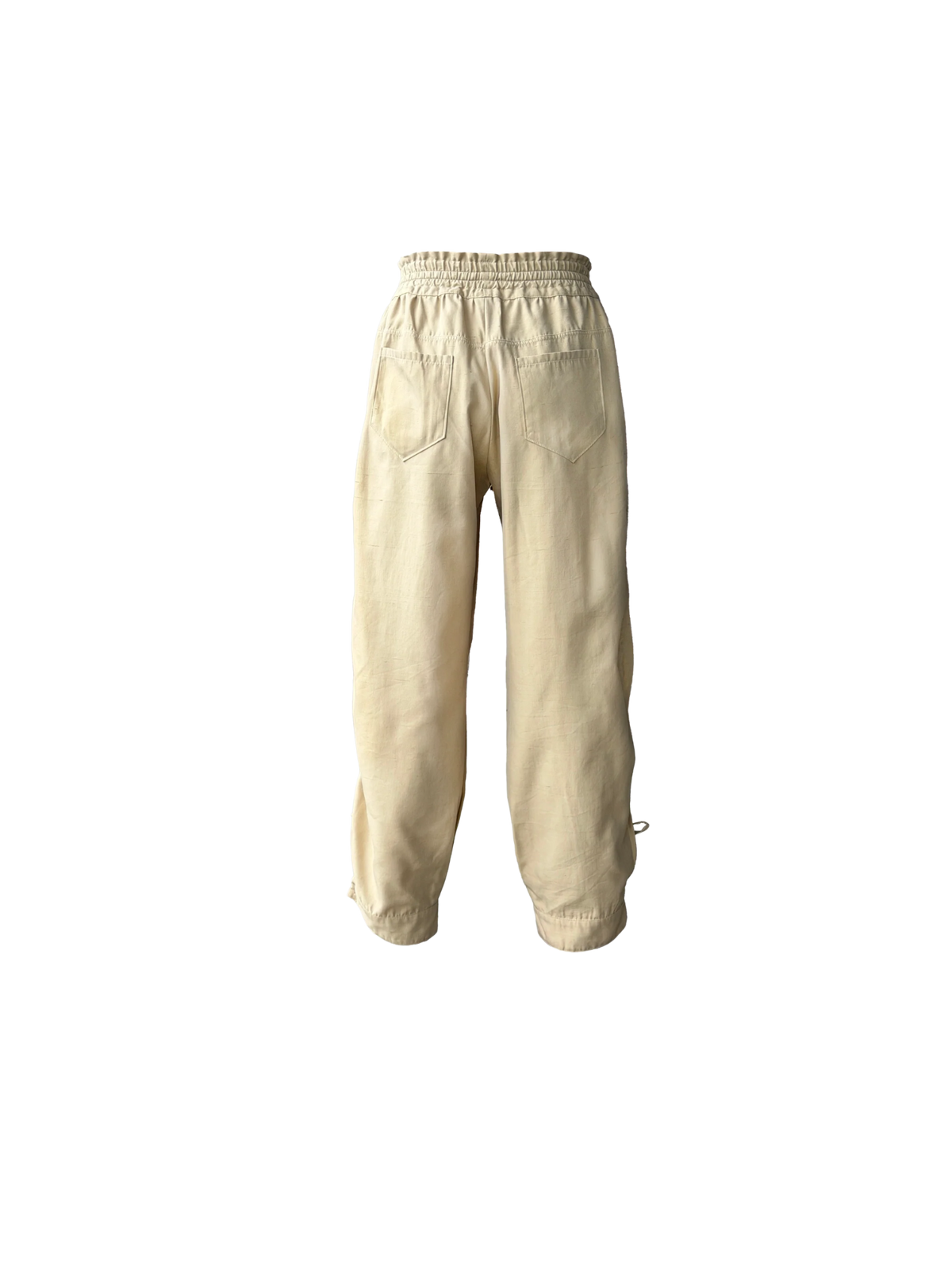 Beige drawstring pants with a relaxed, baggy fit and adjustable cuffs