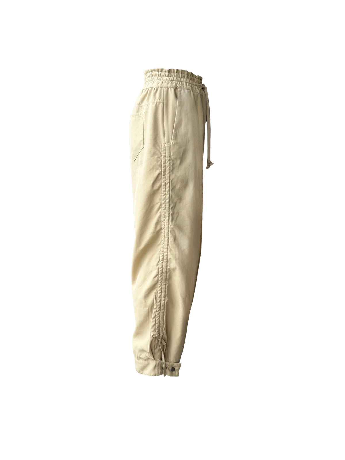 Beige drawstring pants with a relaxed, baggy fit and adjustable cuffs