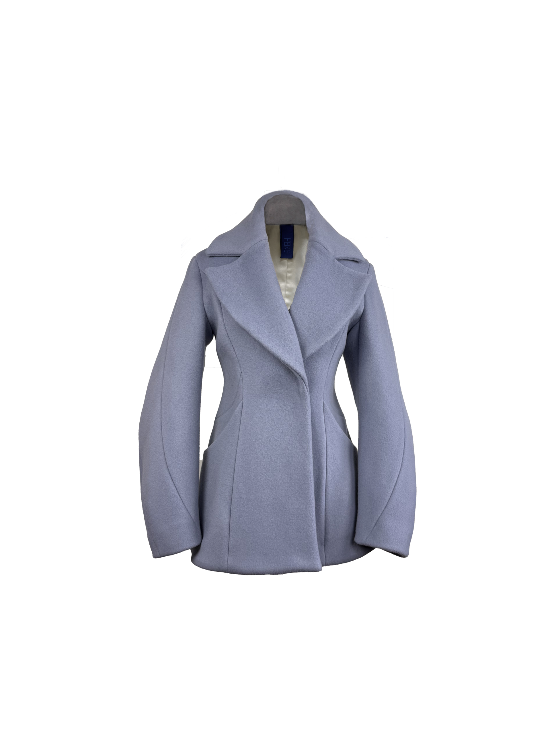 A light periwinkle blue tailored coat with wide lapels, barrel sleeves, and structured shoulders
