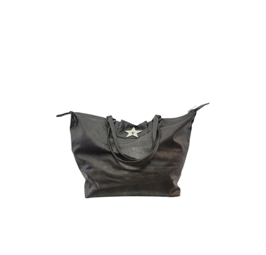 A black vegan leather tote bag with a silver star-shaped metal clasp on the front
