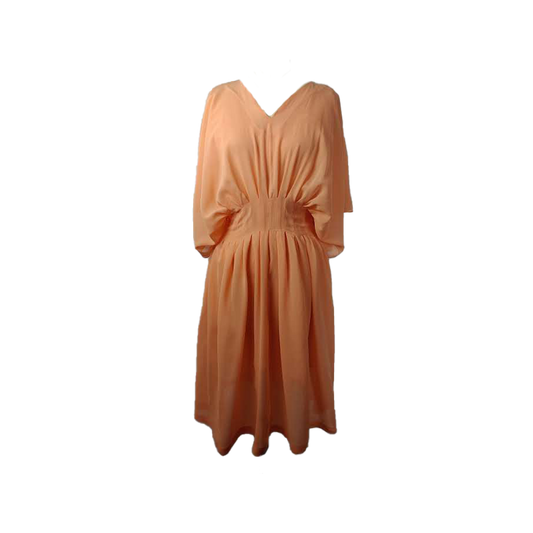 Orange loose fitted v neck dress with an integrated corset waist